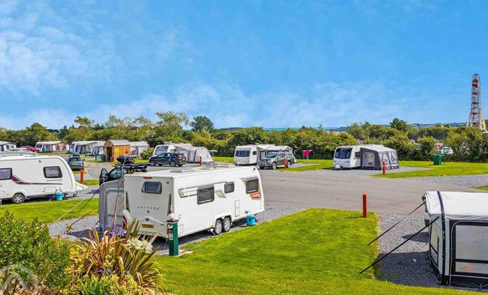Super-sized touring pitches with views of the Big Wheel